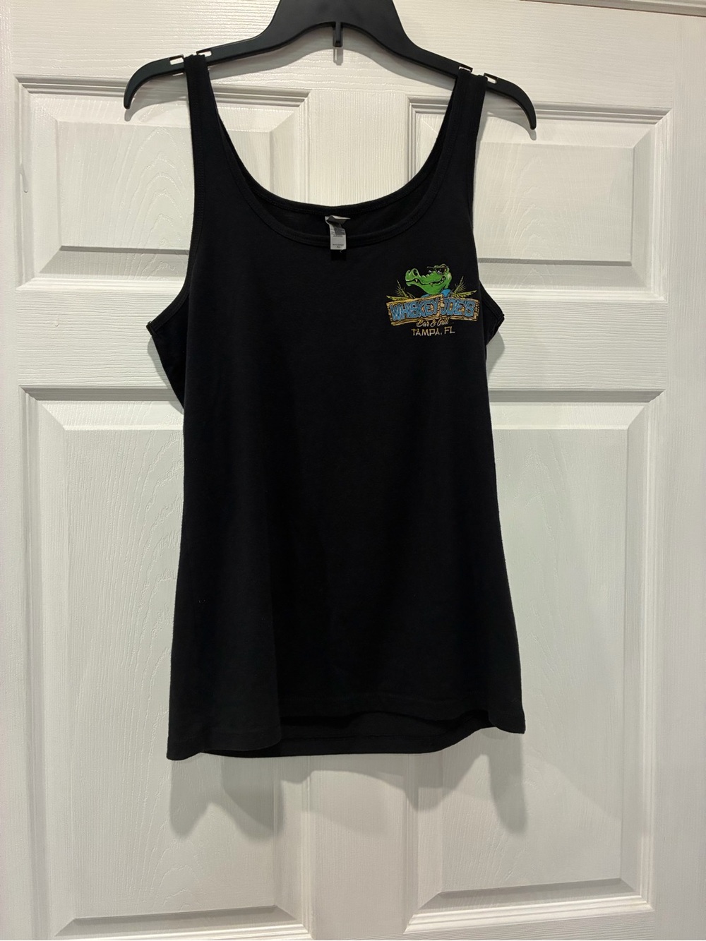 Next Level Apparel Black Tee with Small Green Accent